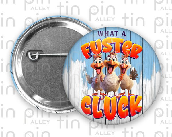 What a Fuster Cluck pin back button with blue and white wood background