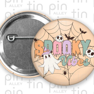Spooky Vibes fun retro Halloween 1.5 inch pin back button with peach background.