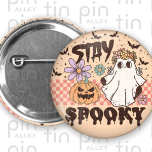 Pastel retro Stay Spooky Halloween 1.5 inch pin back button with a peach colour background.