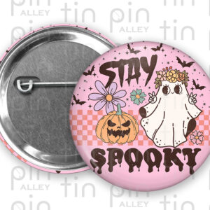 Pastel retro Stay Spooky Halloween 1.5 inch pin back button with a pink colour background.