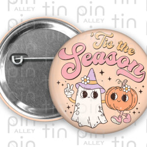'Tis the Season 1.5 in Halloween pin back button with a peach colour pastel background